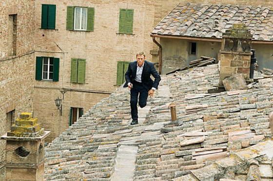 James Bond (Daniel Craig) runs across rooftops in Siena, Italy in "Quantum of Solace".